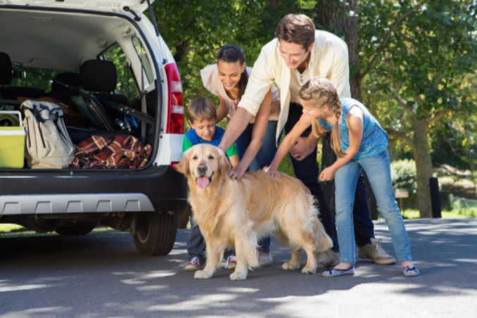 family including dog headed for vacation